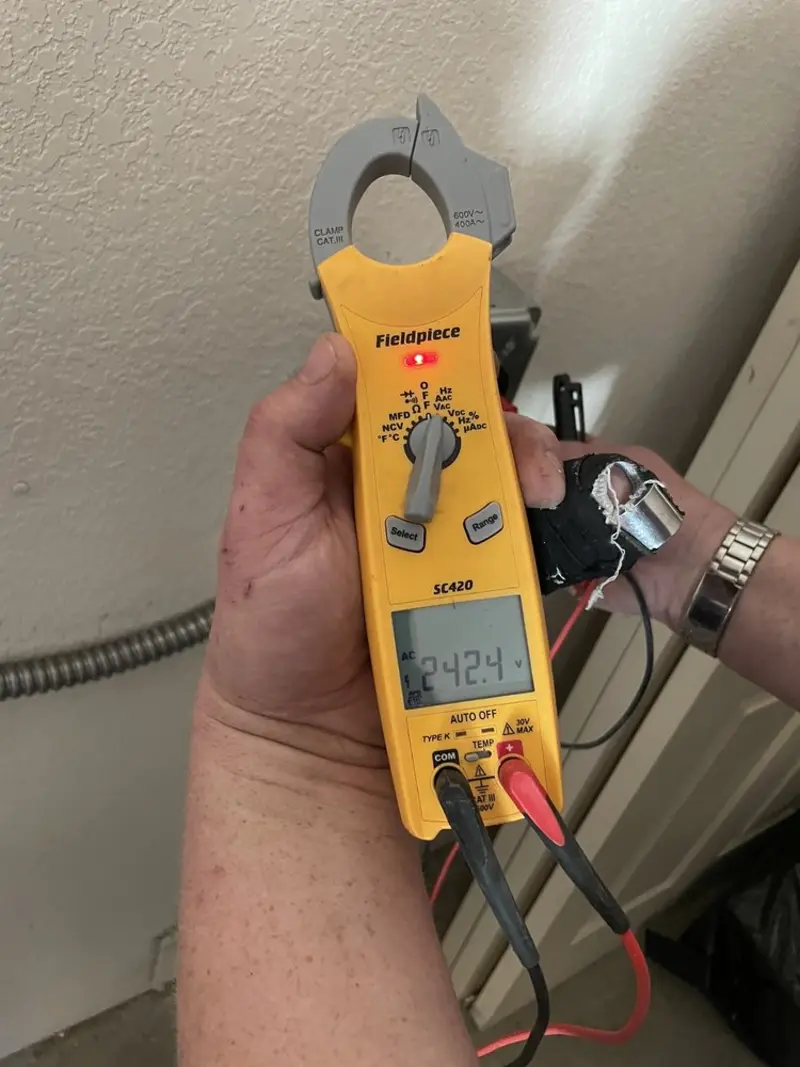 Voltage testing with clamp meter during Electrical Installation Services in Attica